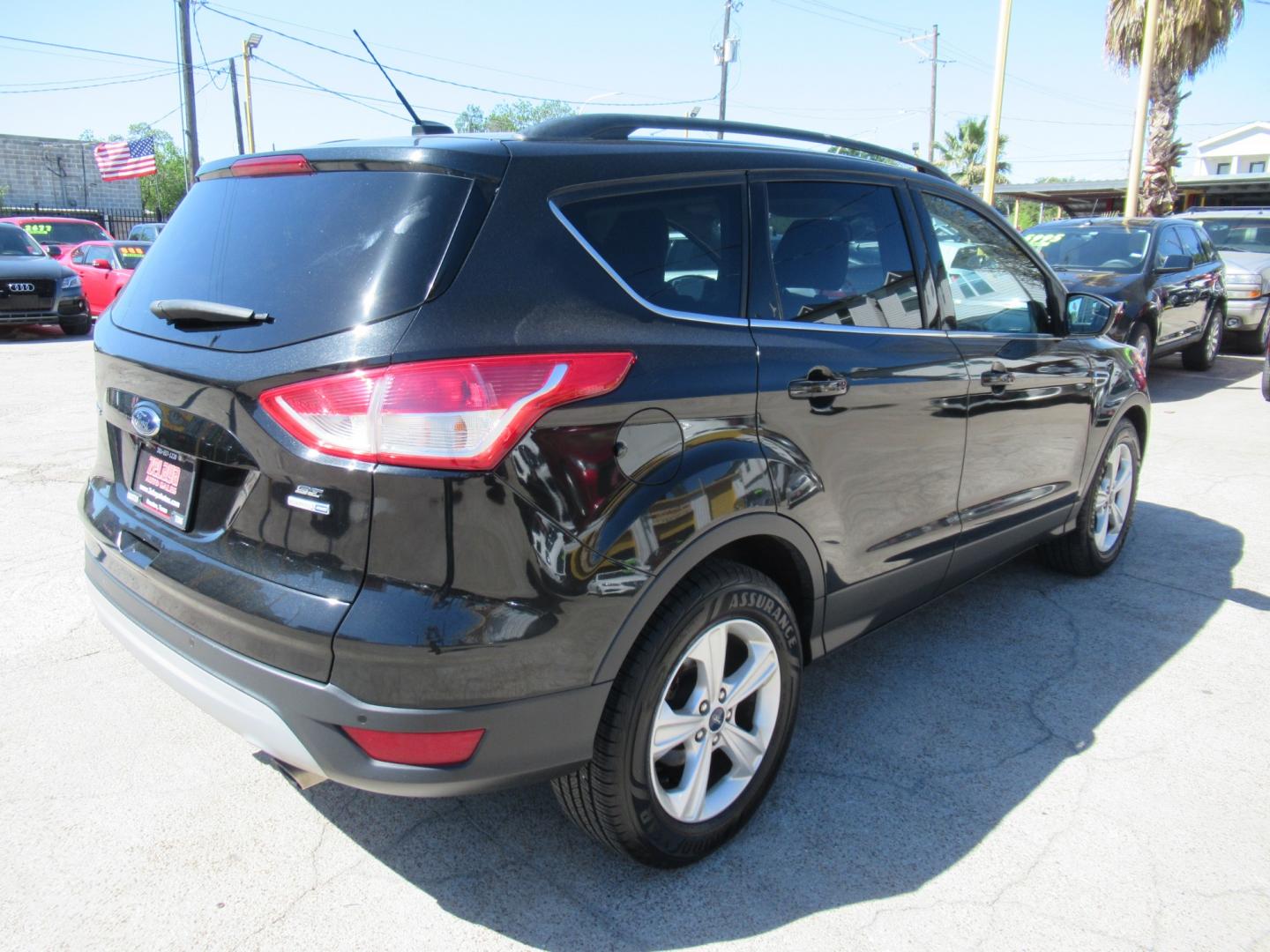 2014 Black /Black Ford Escape SE 4WD (1FMCU9GX5EU) with an 1.6L L4 DOHC 16V engine, Automatic transmission, located at 1511 North Shepherd Dr., Houston, TX, 77008, (281) 657-1221, 29.798361, -95.412560 - 2014 FORD ESCAPE SE VIN: 1FMCU9GX5EUC37295 1 F M C U 9 G X 5 E U C 3 7 2 9 5 4 DOOR WAGON/SPORT UTILITY 1.6L I4 F DOHC 16V GASOLINE FRONT WHEEL DRIVE W/ 4X4 - Photo#23